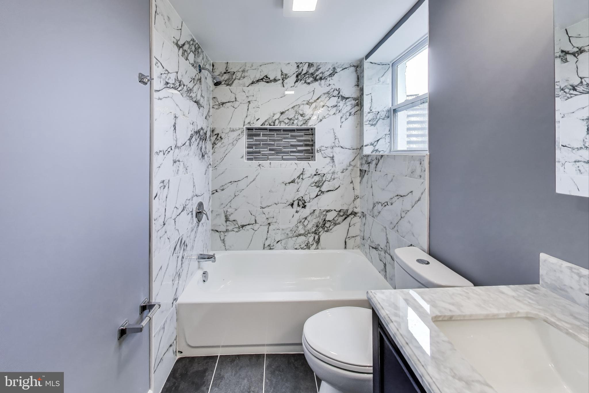 2500 Gehb Avenue Baltimore, MD 21227 - Photo 42 of 53 a bathroom with a toilet and a bath tub