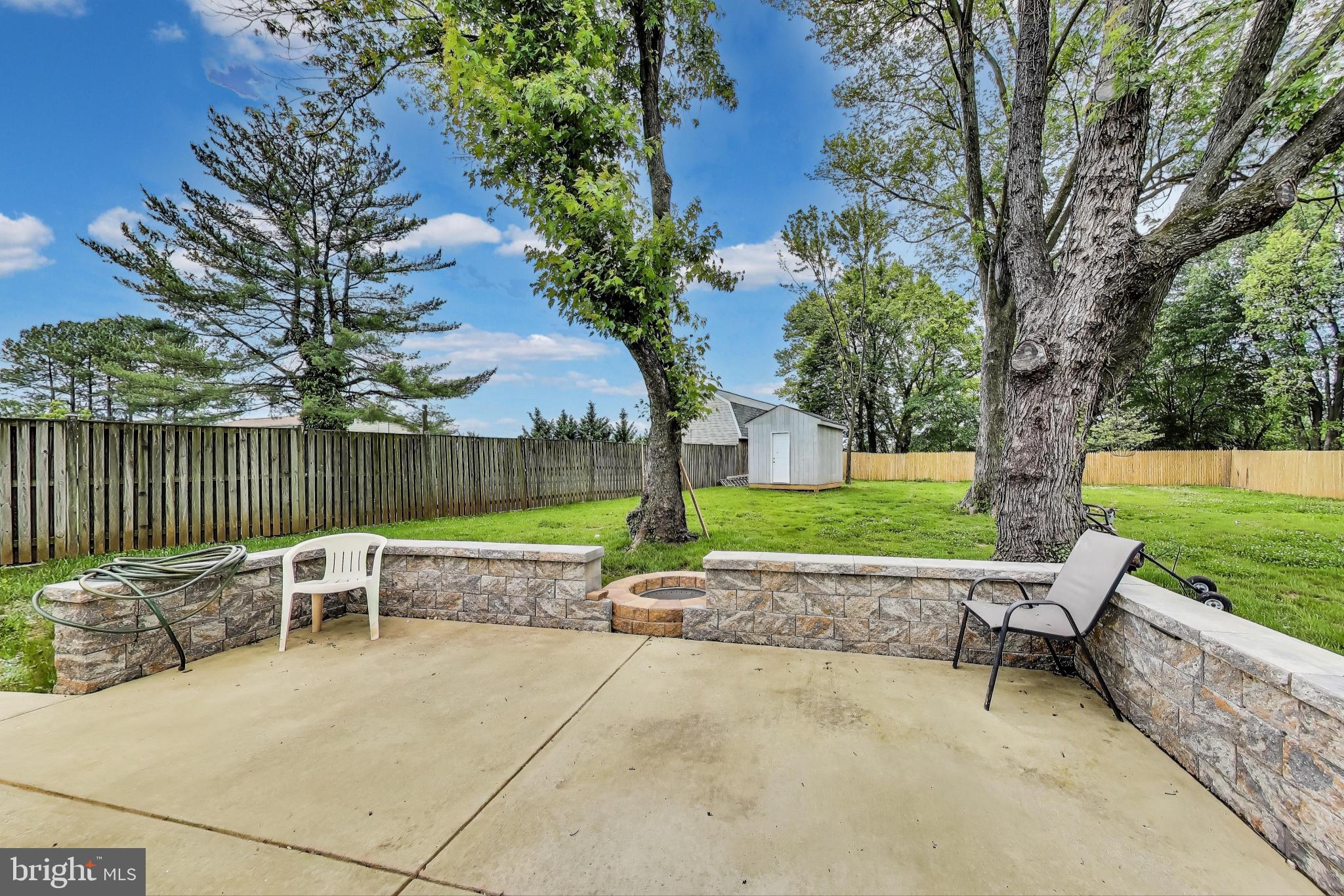 2500 Gehb Avenue Baltimore, MD 21227 - Photo 46 of 53 a view of a patio with a table and chairs next to a yard
