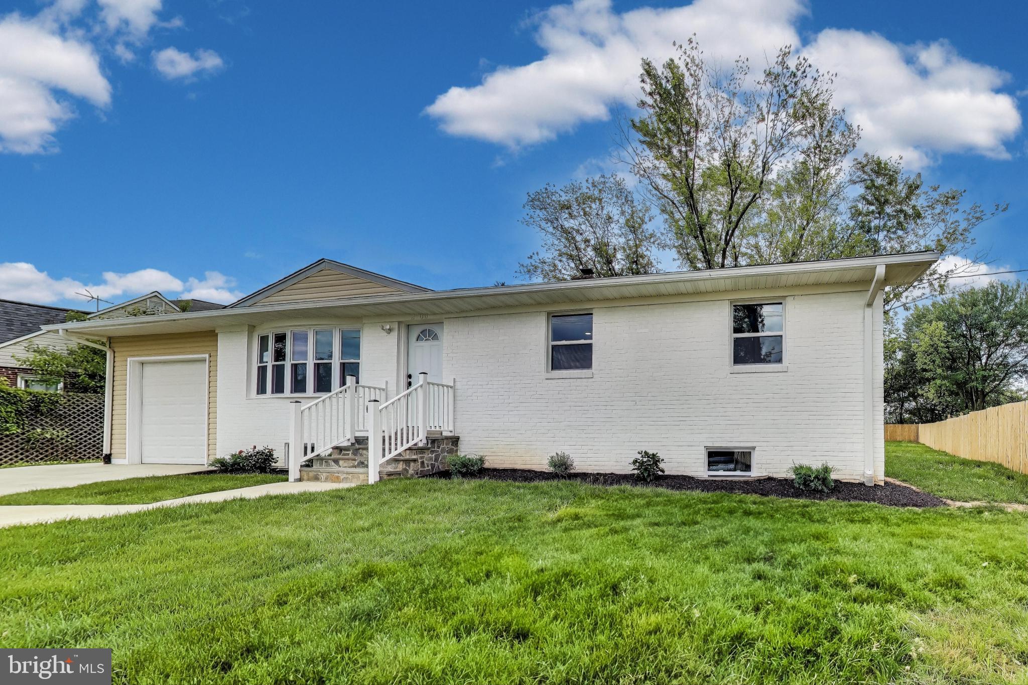 2500 Gehb Avenue Baltimore, MD 21227 - Photo 6 of 53 a front view of a house with a yard