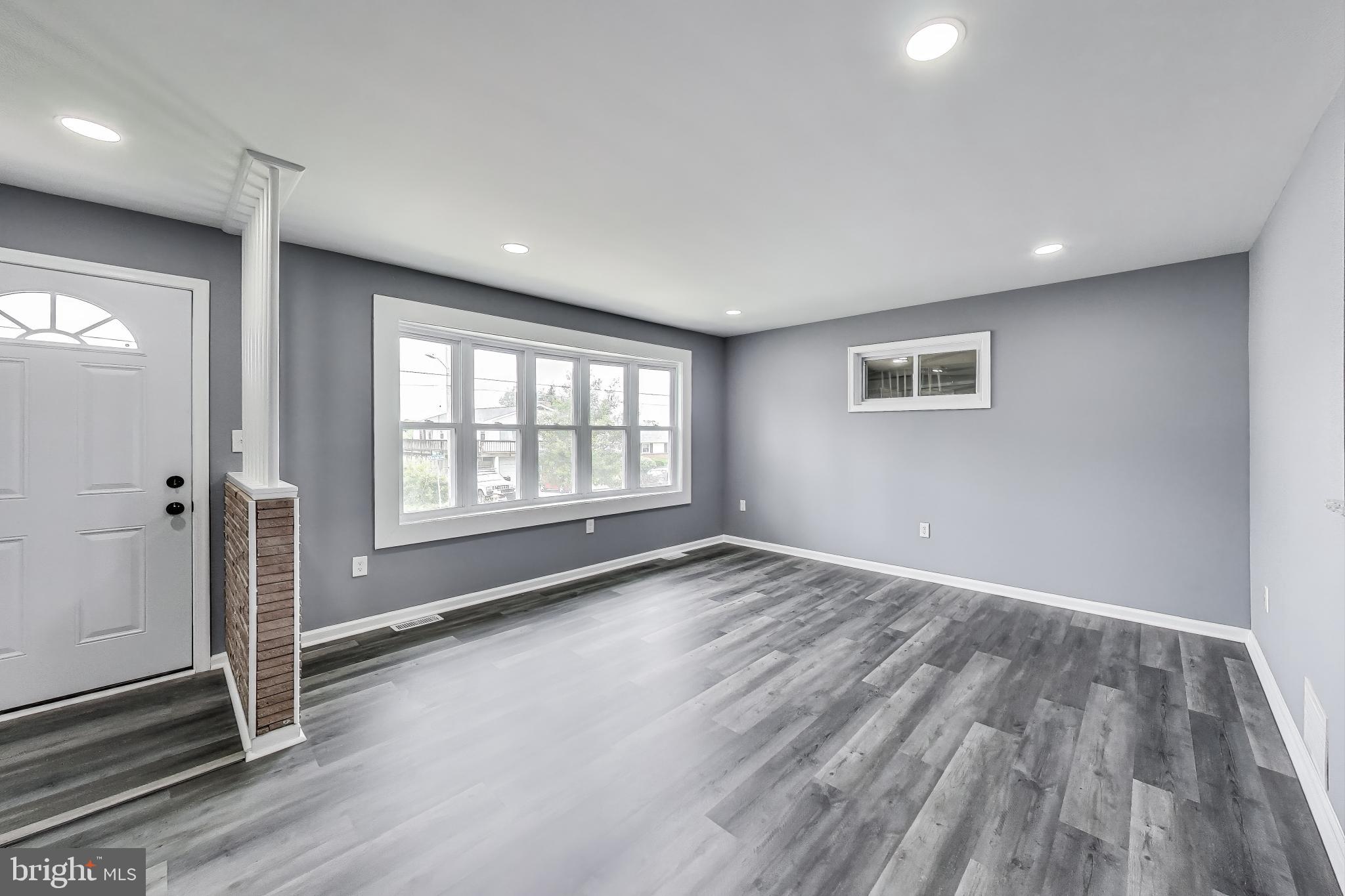 2500 Gehb Avenue Baltimore, MD 21227 - Photo 9 of 53 a view of empty room with wooden floor and fan