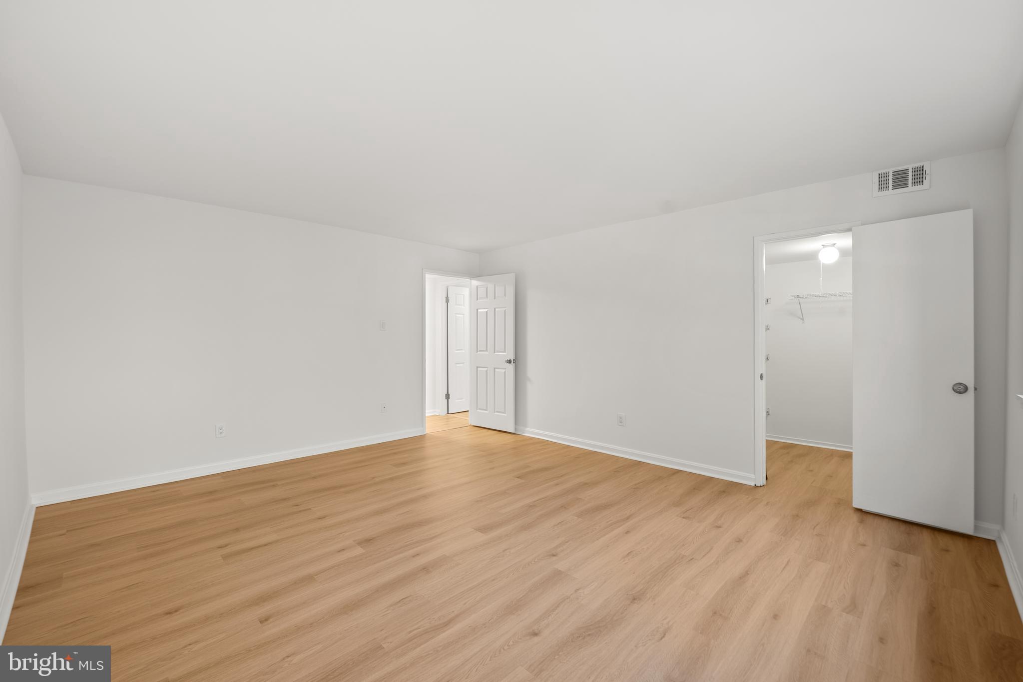 1656 Parkcrest Circle, Unit 2D/301 Reston, VA 20190 - Photo 18 of 29 a view of an empty room and wooden floor