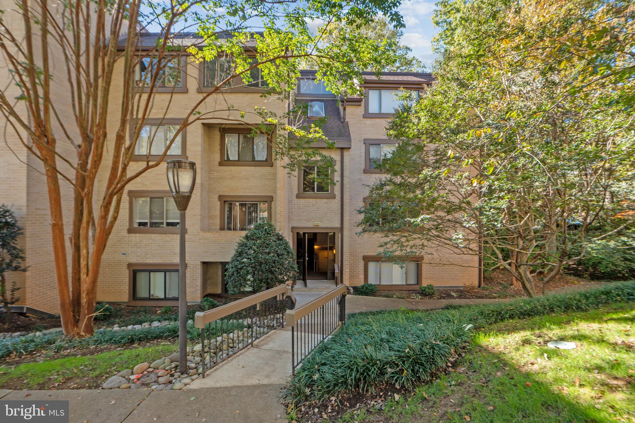 1656 Parkcrest Circle, Unit 2D/301 Reston, VA 20190 - Photo 2 of 29 front view of a house with a yard