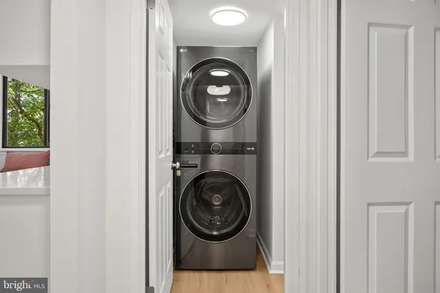 a view of a hallway with washer and dryer