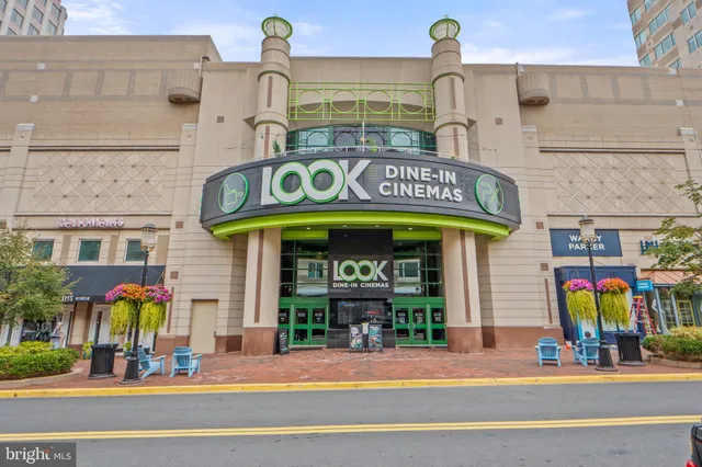 a view of a building with sitting area