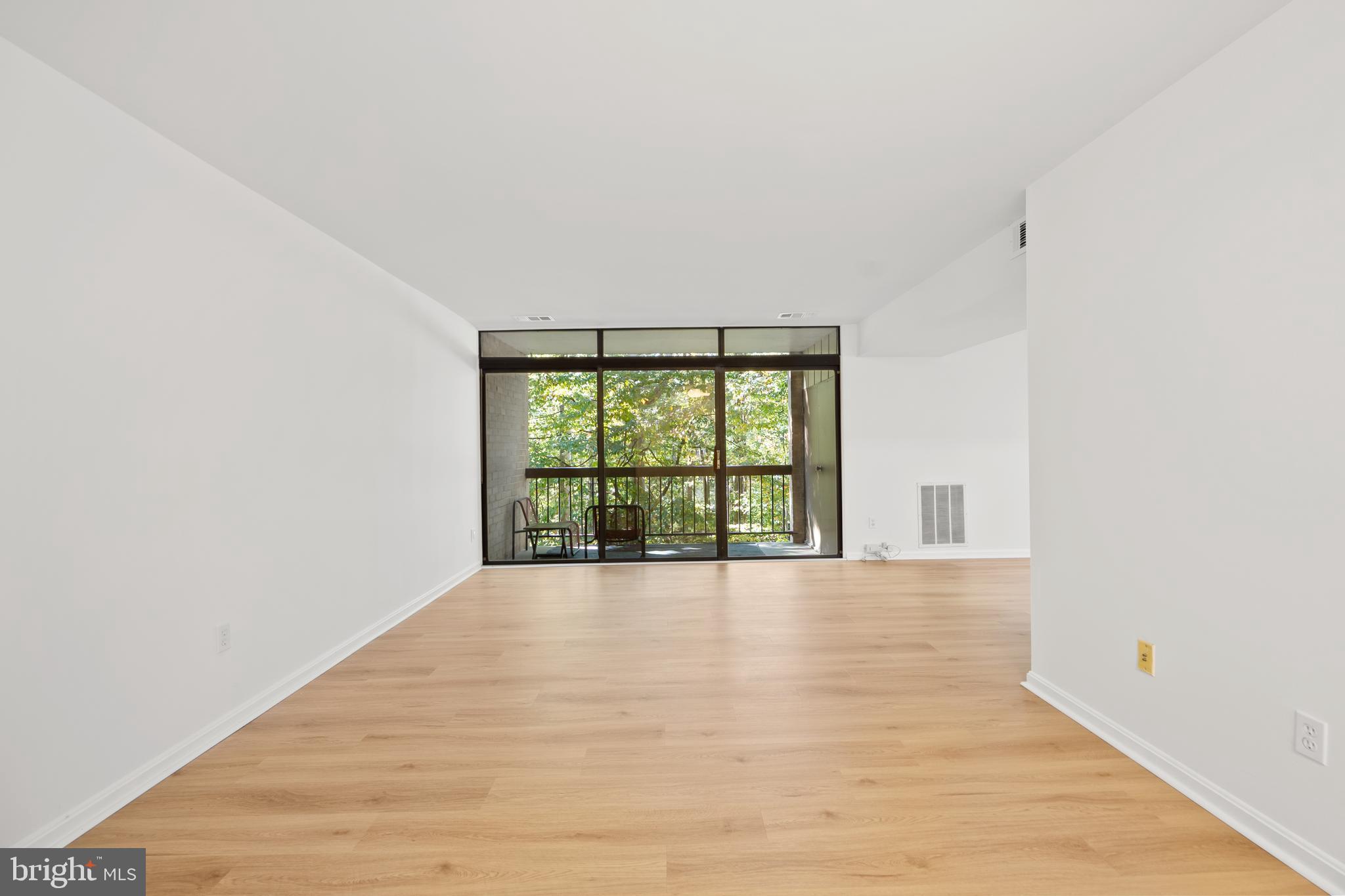 1656 Parkcrest Circle, Unit 2D/301 Reston, VA 20190 - Photo 7 of 29 a view of an empty room with a window