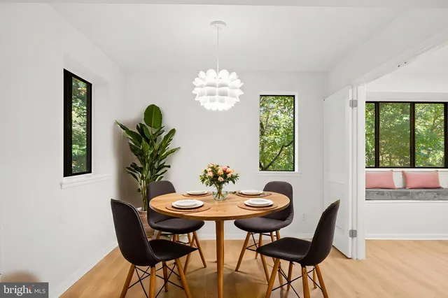 a view of a dining room with furniture window and outside view