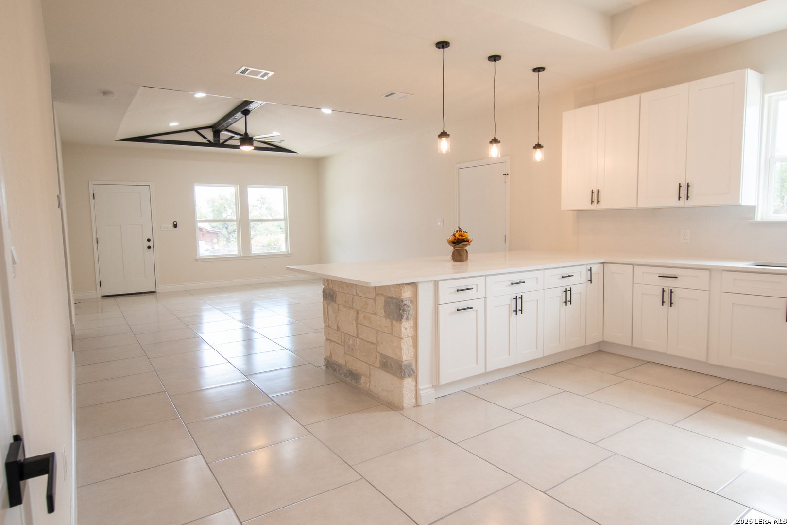 2962 Contour Drive Spring Branch, TX 78070 - Photo 14 of 34 a large kitchen with cabinets and a window