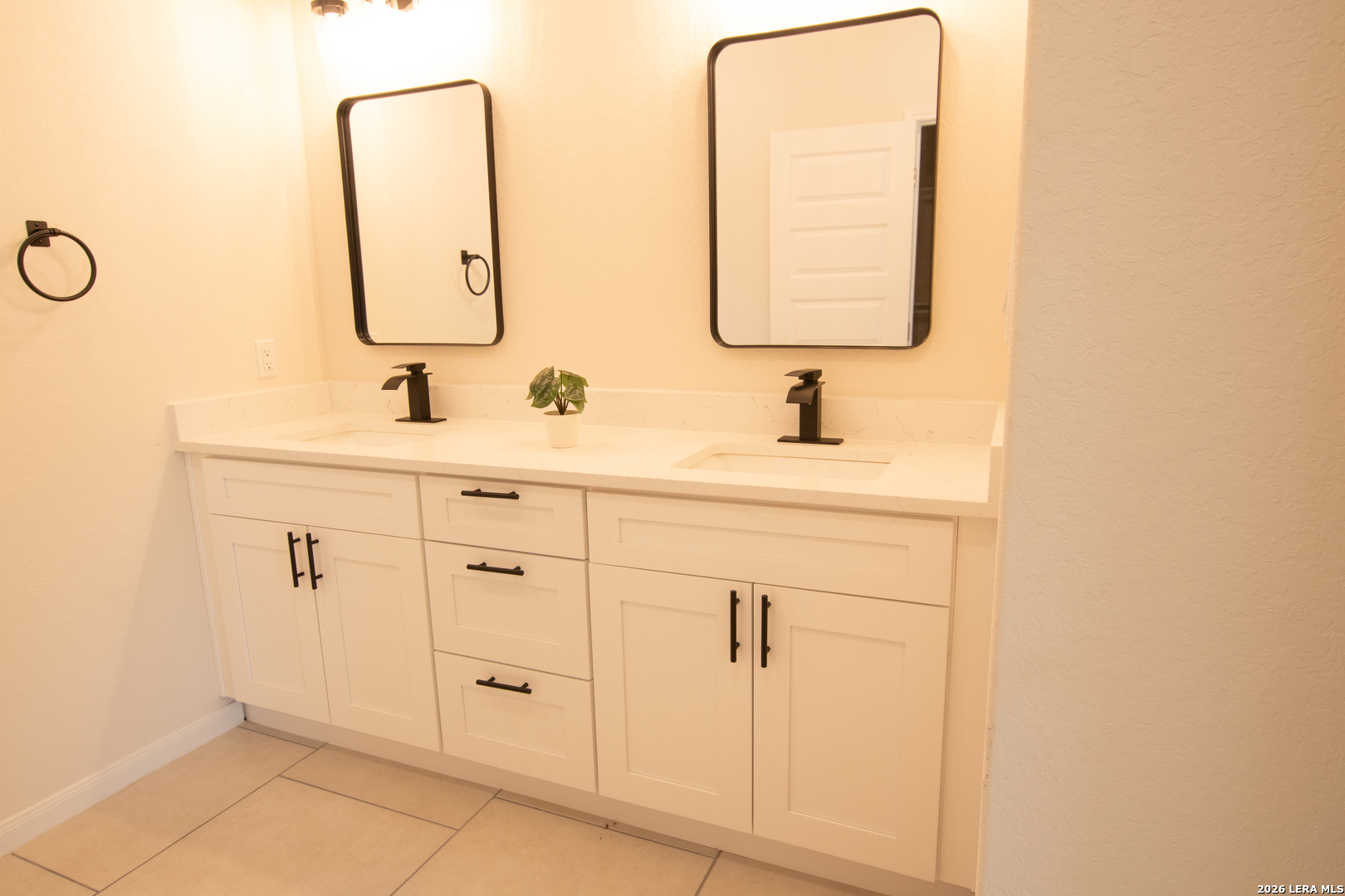 2962 Contour Drive Spring Branch, TX 78070 - Photo 19 of 34 a bathroom with a double vanity sink mirror and