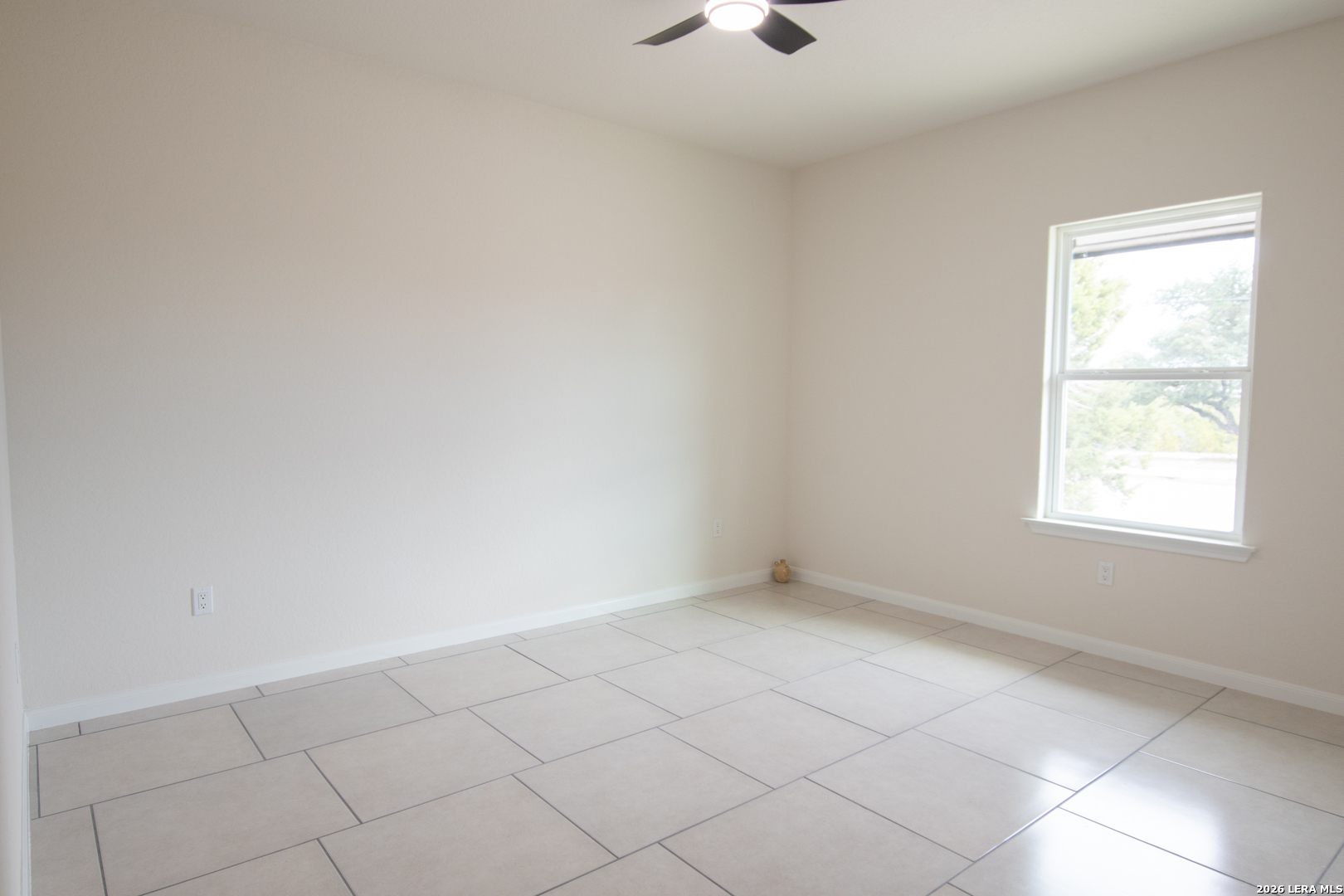 2962 Contour Drive Spring Branch, TX 78070 - Photo 25 of 34 an empty room with a white cabinet and a window