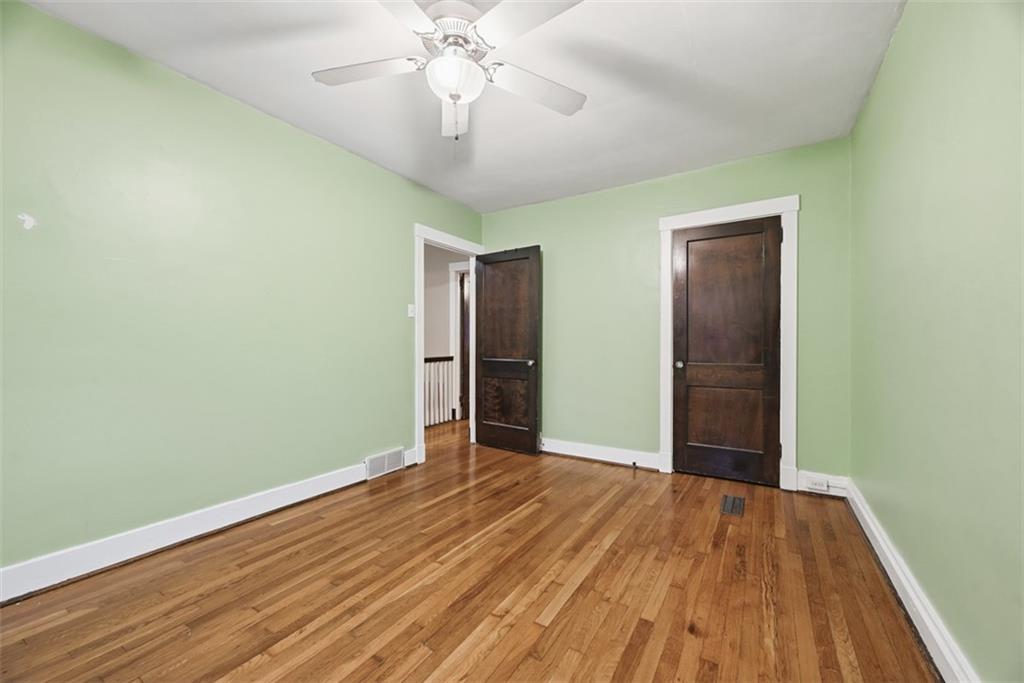 436 44th Street Pittsburgh, PA 15201 - Photo 19 of 30 a view of an empty room with wooden floor