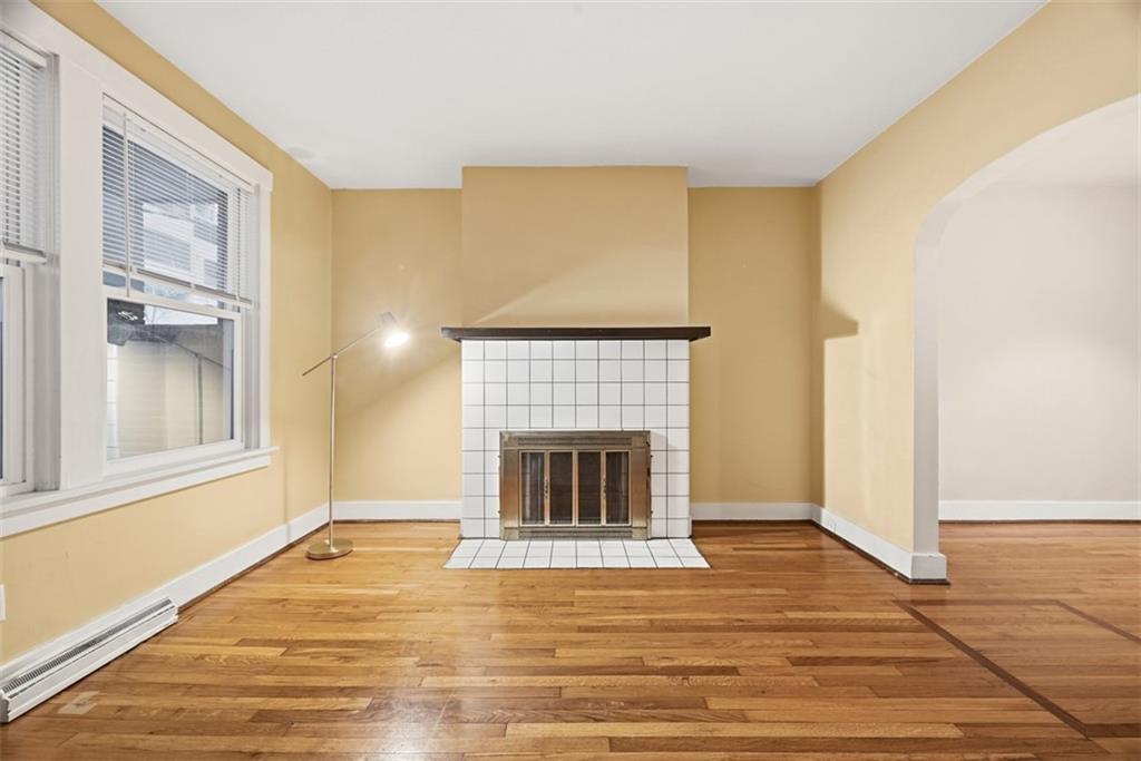 436 44th Street Pittsburgh, PA 15201 - Photo 6 of 30 a view of an empty room with wooden floor and a window