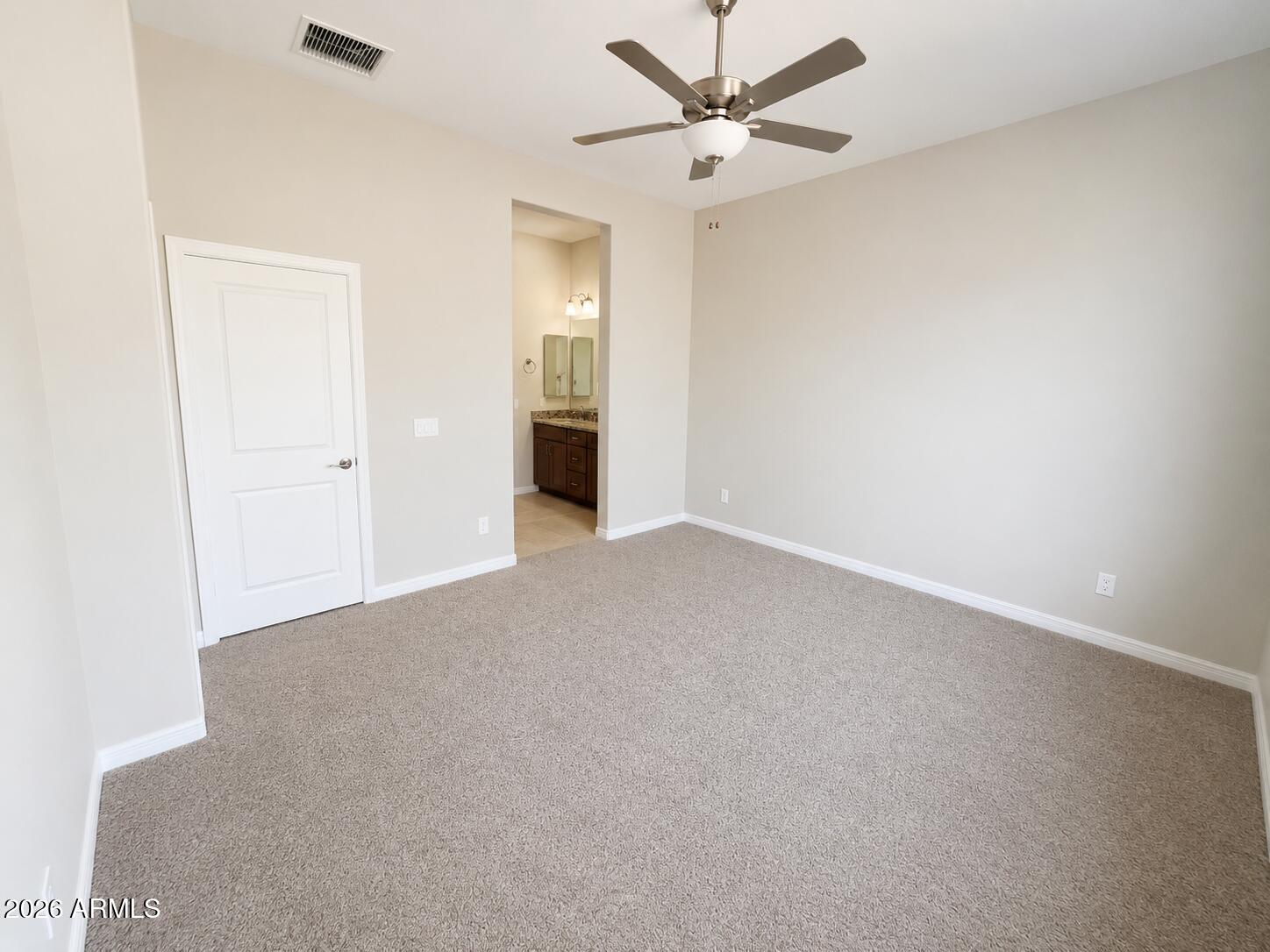 786 Flat Iron Road, Unit LOT 503 Clarkdale, AZ 86324 - Photo 6 of 14 an empty room with closet and a ceiling fan