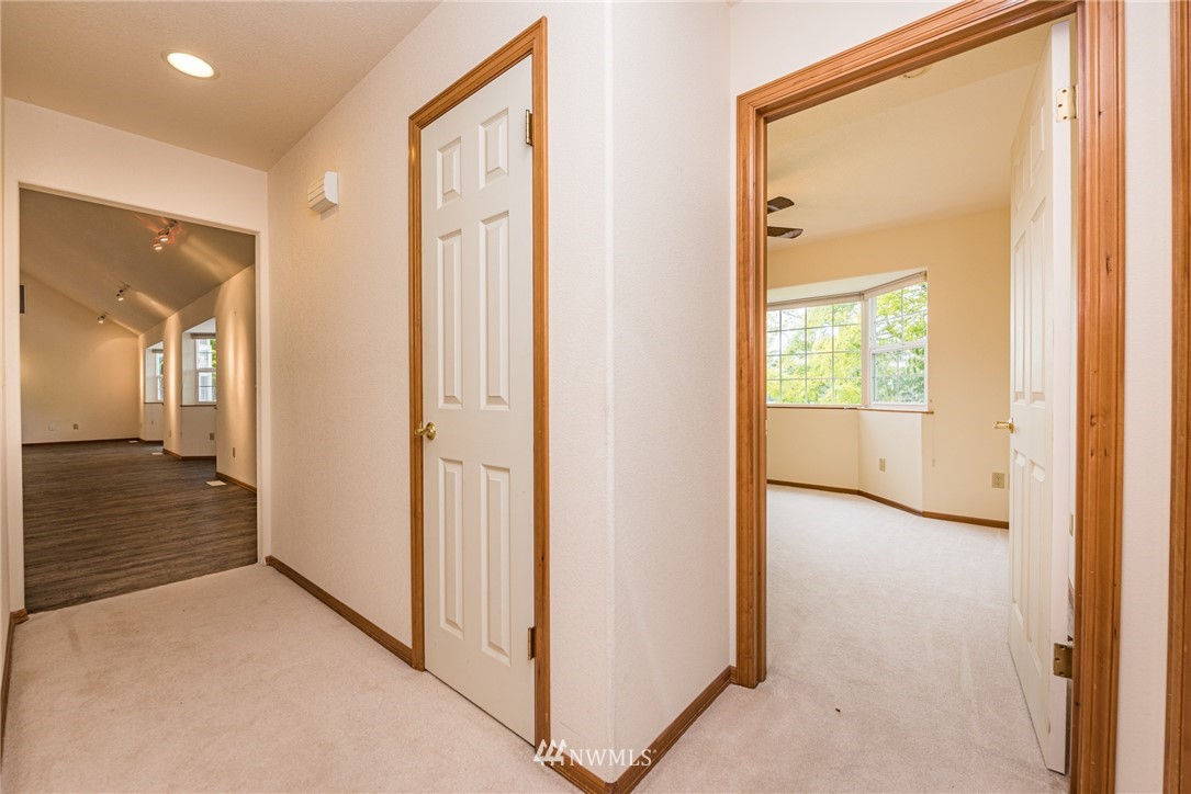 2367 Happy Valley Road Sequim, WA 98382 - Photo 14 of 39 a view of a hallway with wooden floor
