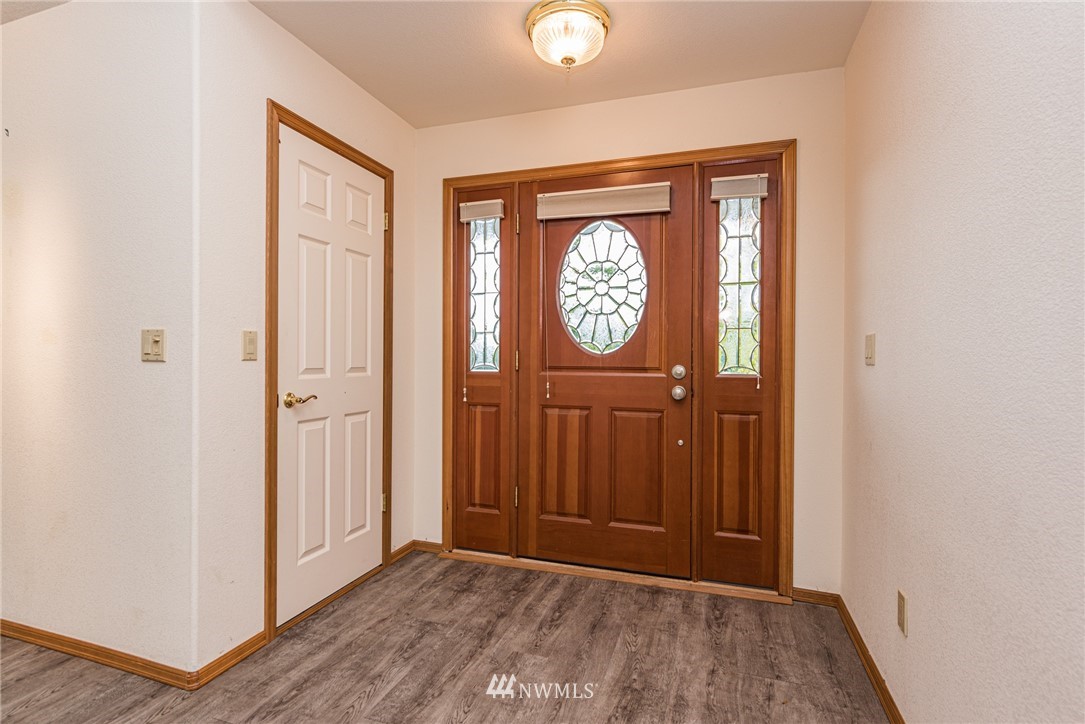 2367 Happy Valley Road Sequim, WA 98382 - Photo 3 of 39 a view of a hallway with wooden floor