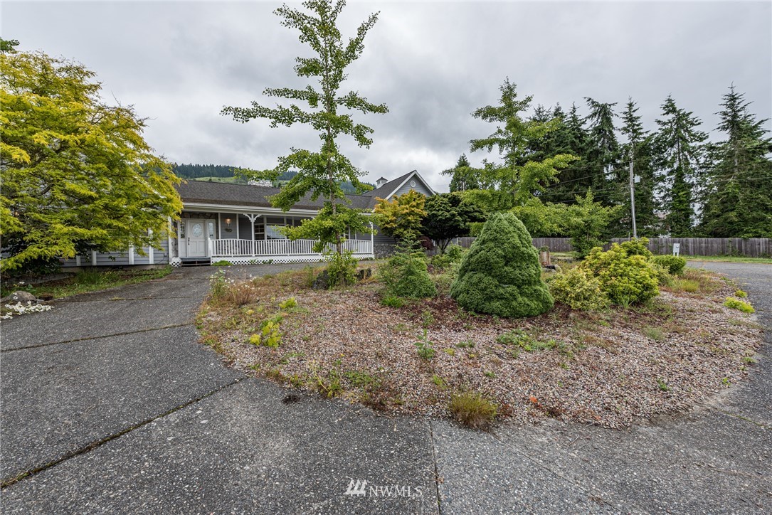 2367 Happy Valley Road Sequim, WA 98382 - Photo 33 of 39 a view of a garden with a house in the background