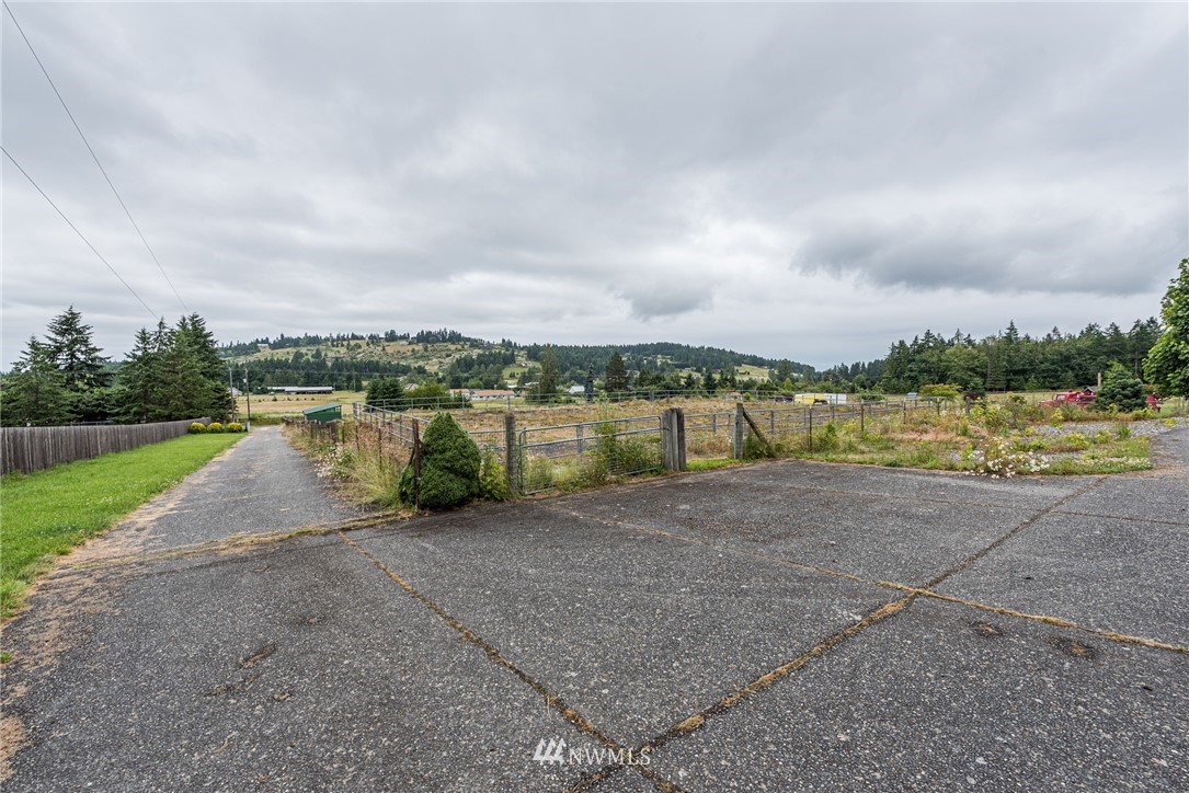 2367 Happy Valley Road Sequim, WA 98382 - Photo 34 of 39 a view of a lake with houses in the back