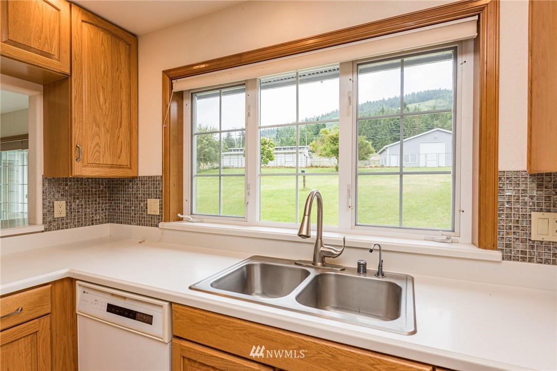 2367 Happy Valley Road Sequim, WA 98382 - Photo 6 of 39 a kitchen with a sink and a window