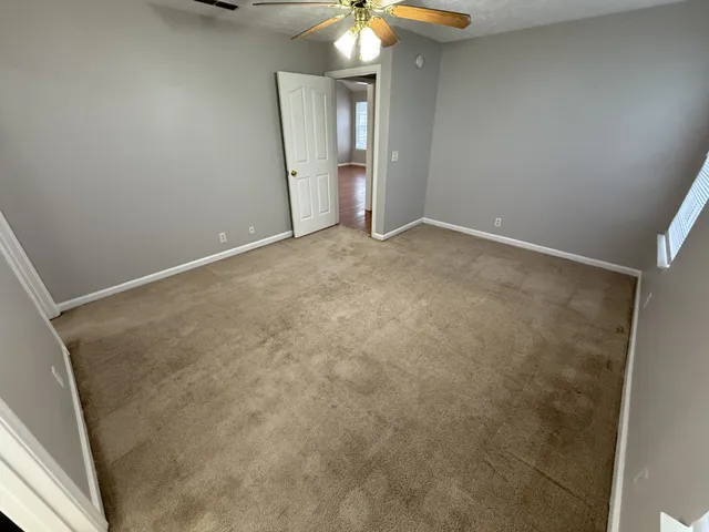 a view of an empty room and window