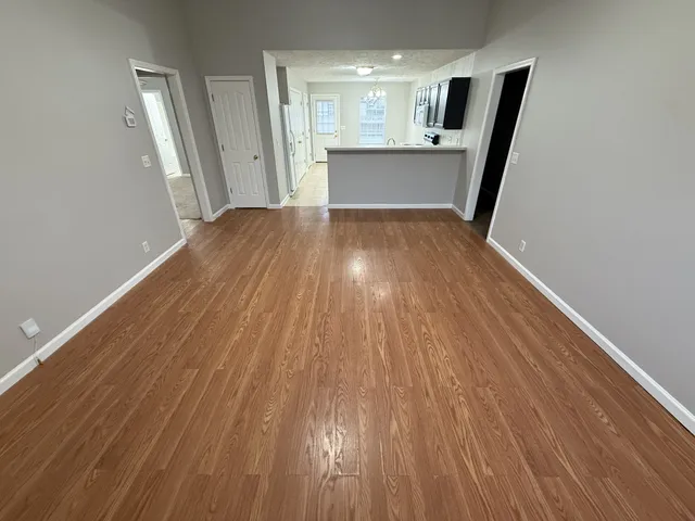 a view of a kitchen from a hallway