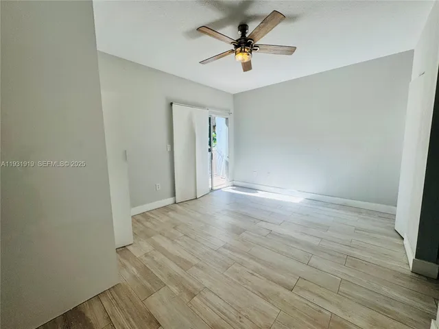 a bathroom with a toilet and a mirror