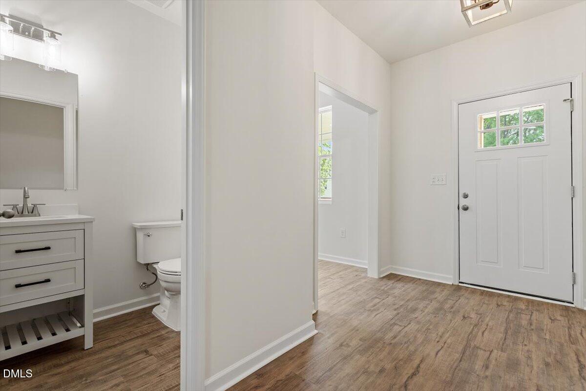 1408 South Street Durham, NC 27707 - Photo 12 of 37 a view of bathroom with toilet vanity and a window