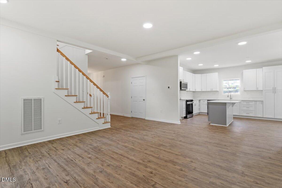 1408 South Street Durham, NC 27707 - Photo 15 of 37 a view of kitchen with wooden floor and electronic appliances