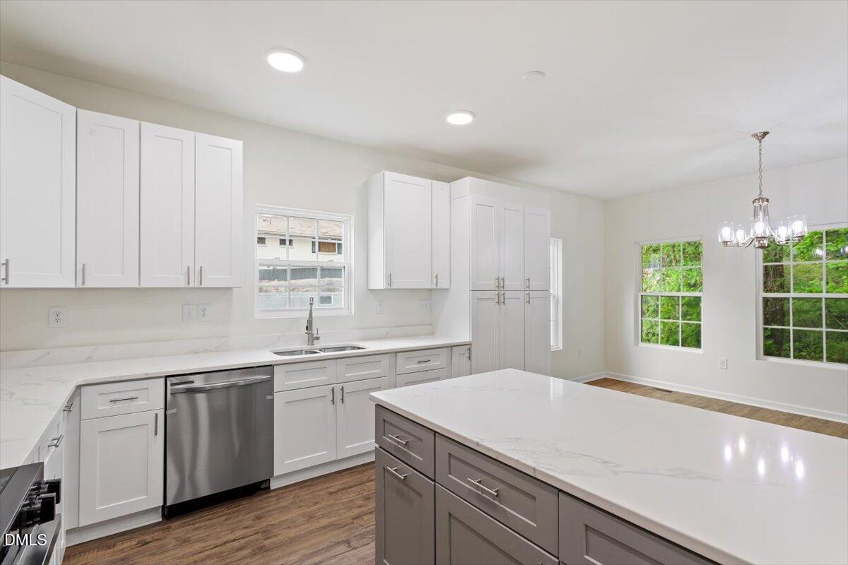 1408 South Street Durham, NC 27707 - Photo 23 of 37 a kitchen with a sink window and cabinets
