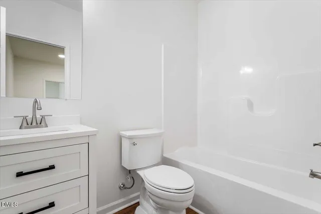 a bathroom with a sink a toilet and a bathtub