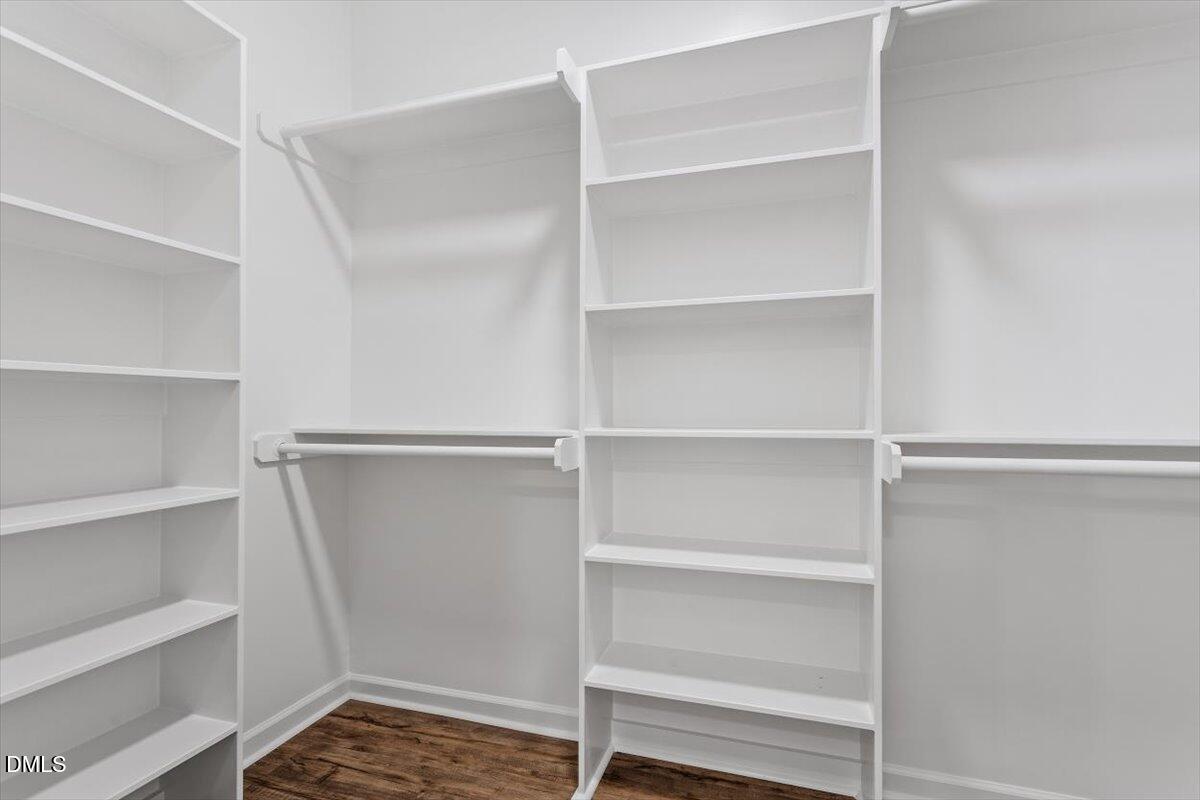 1408 South Street Durham, NC 27707 - Photo 37 of 37 a view of walk in closet with empty racks