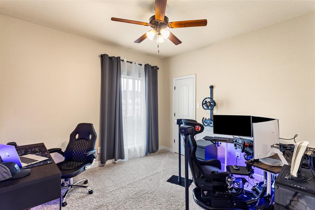 223 Cottongame Road Weatherford, TX 76088 - Photo 22 of 39 a living room with furniture a flat screen tv and a window