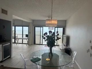 a dining room with chandelier