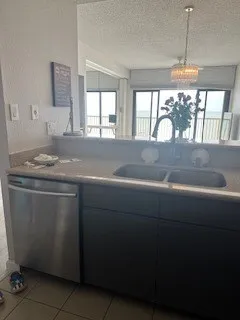 a kitchen with a sink stove and window