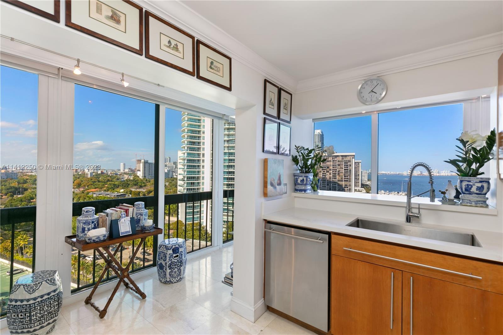 2333 Brickell Avenue, Unit 1511 Miami, FL 33129 - Photo 12 of 59 a kitchen with a sink and a large window