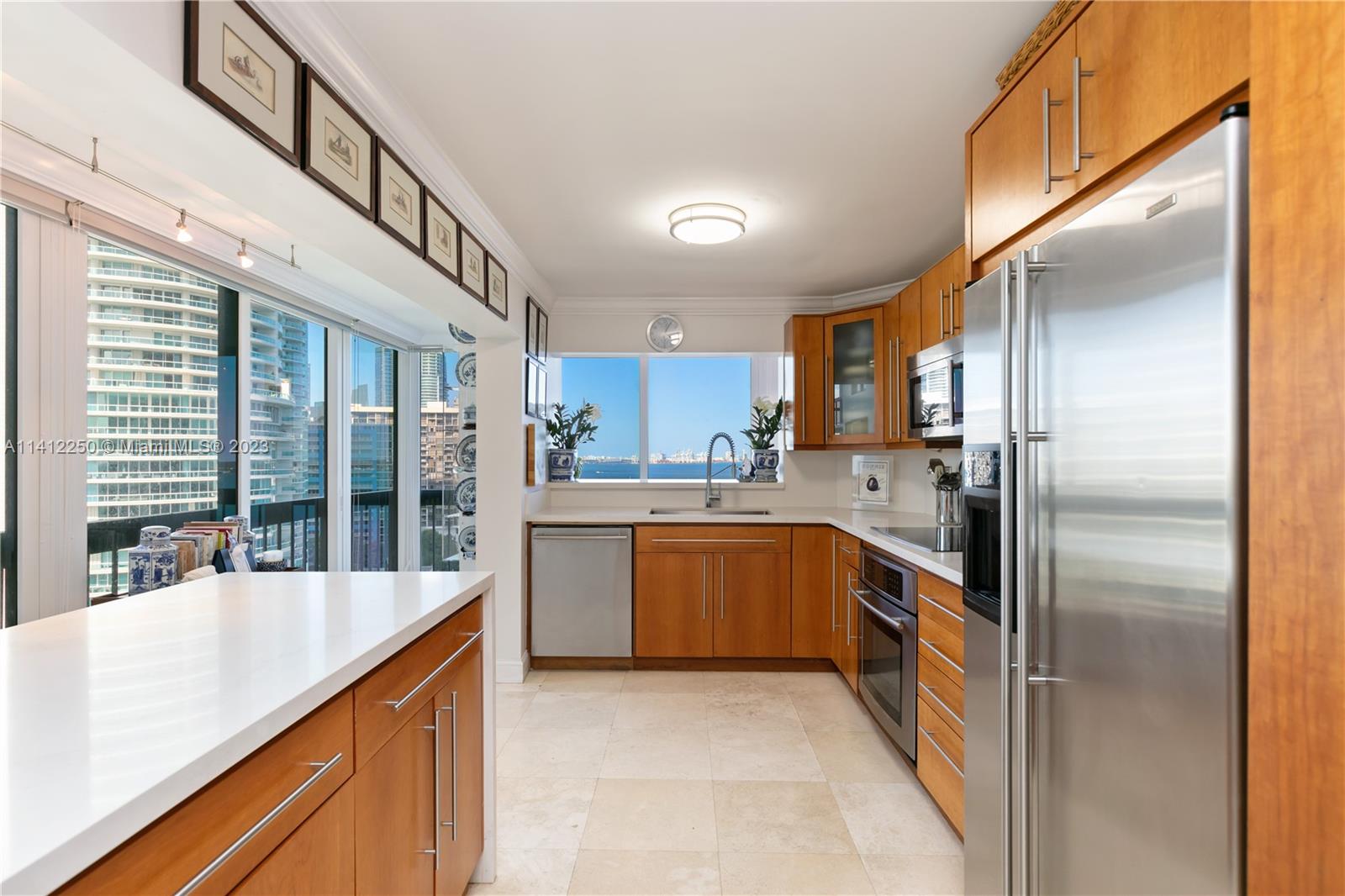 2333 Brickell Avenue, Unit 1511 Miami, FL 33129 - Photo 13 of 59 a kitchen with stainless steel appliances granite countertop a refrigerator and a sink