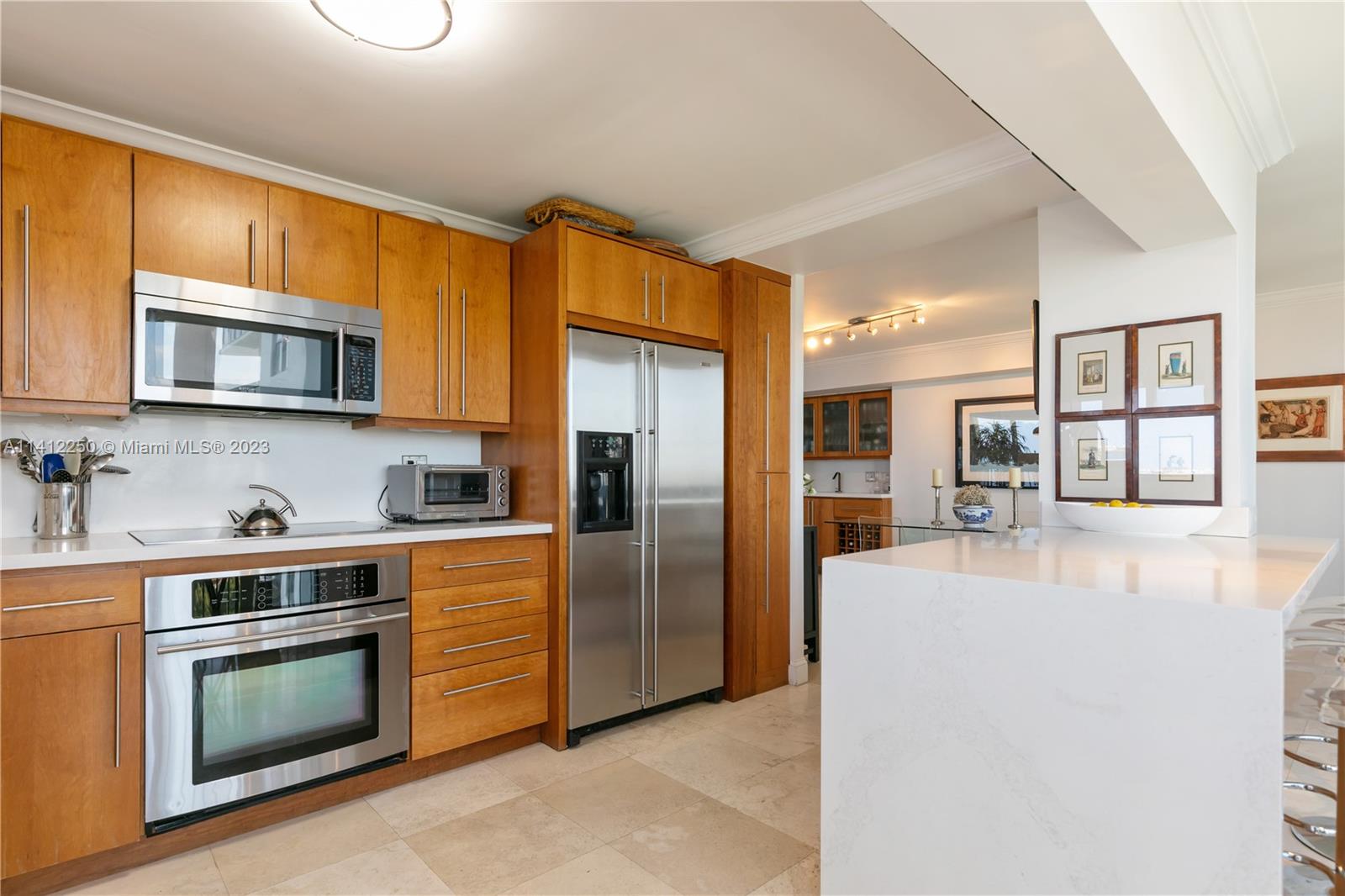 2333 Brickell Avenue, Unit 1511 Miami, FL 33129 - Photo 18 of 59 a kitchen with stainless steel appliances granite countertop a refrigerator stove top oven a sink and dishwasher