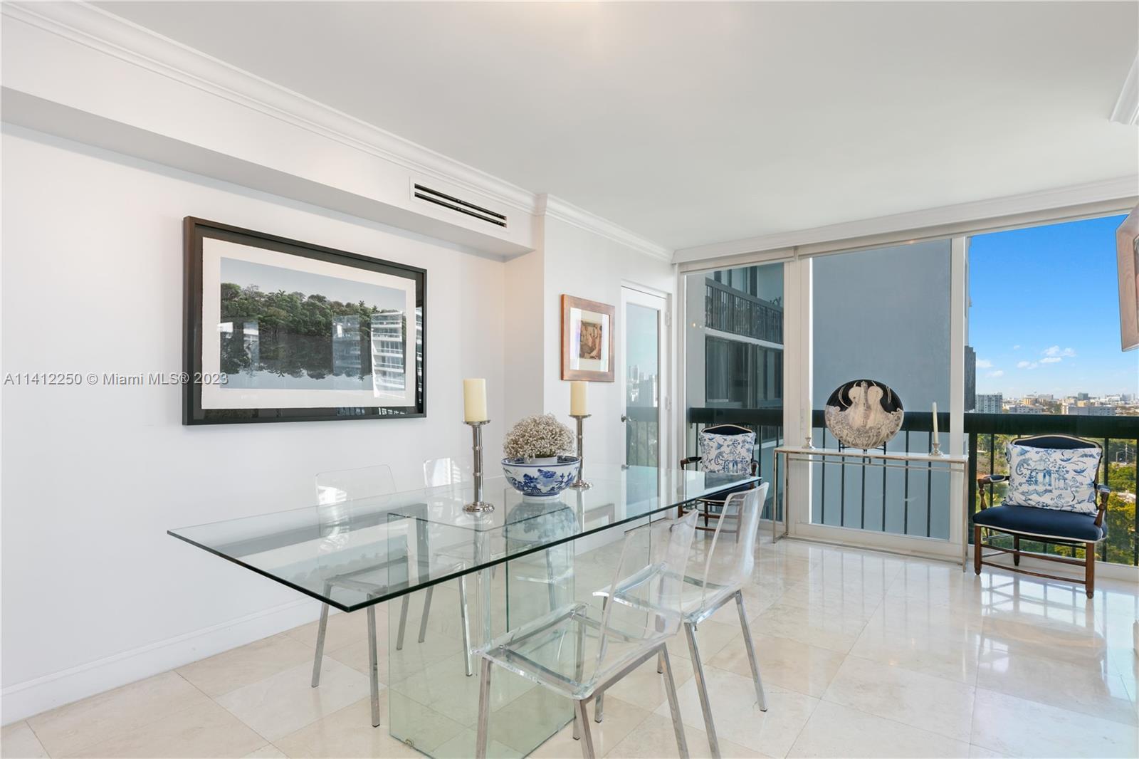 2333 Brickell Avenue, Unit 1511 Miami, FL 33129 - Photo 20 of 59 a dining room with furniture and window