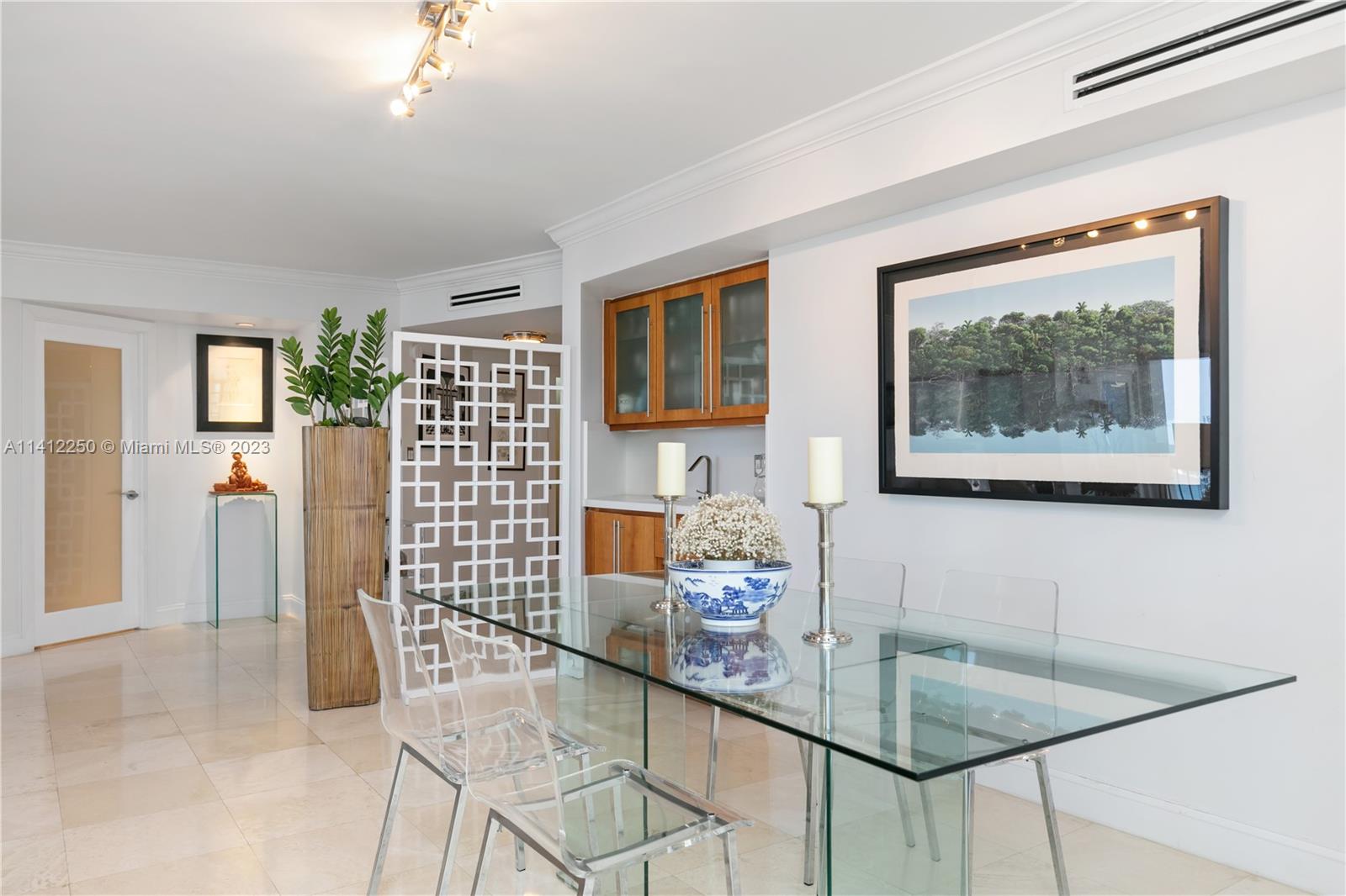 2333 Brickell Avenue, Unit 1511 Miami, FL 33129 - Photo 21 of 59 a dining room with furniture and window