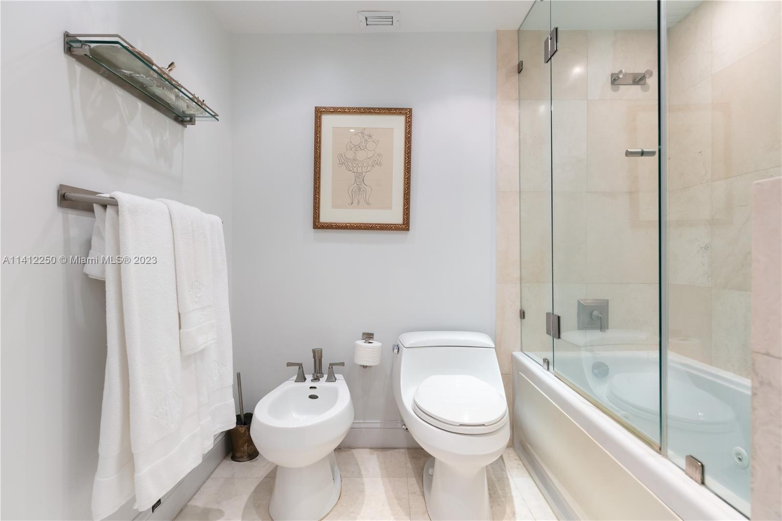 2333 Brickell Avenue, Unit 1511 Miami, FL 33129 - Photo 30 of 59 a bathroom with a toilet sink and shower