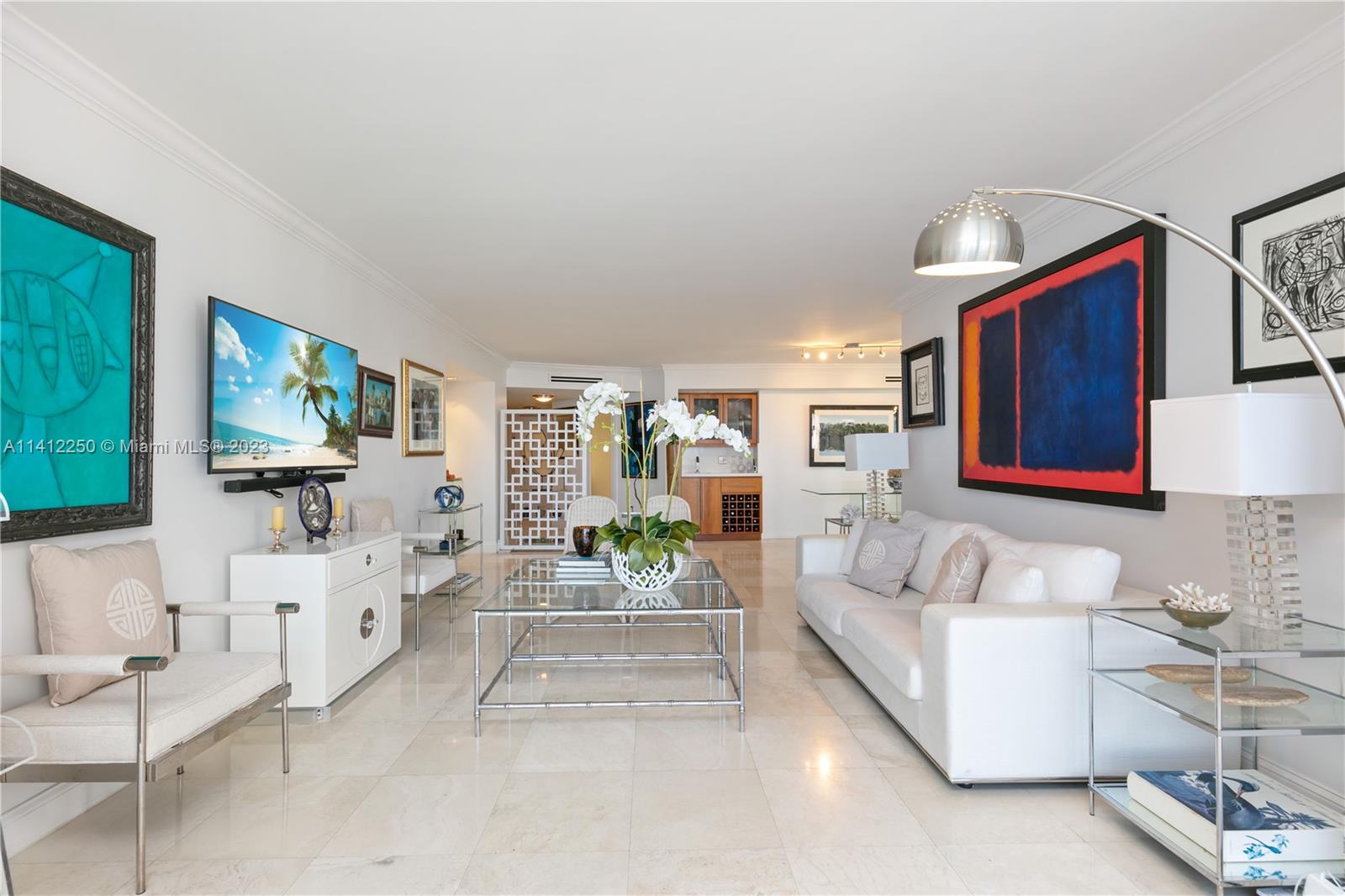 2333 Brickell Avenue, Unit 1511 Miami, FL 33129 - Photo 3 of 59 a living room with furniture and a flat screen tv