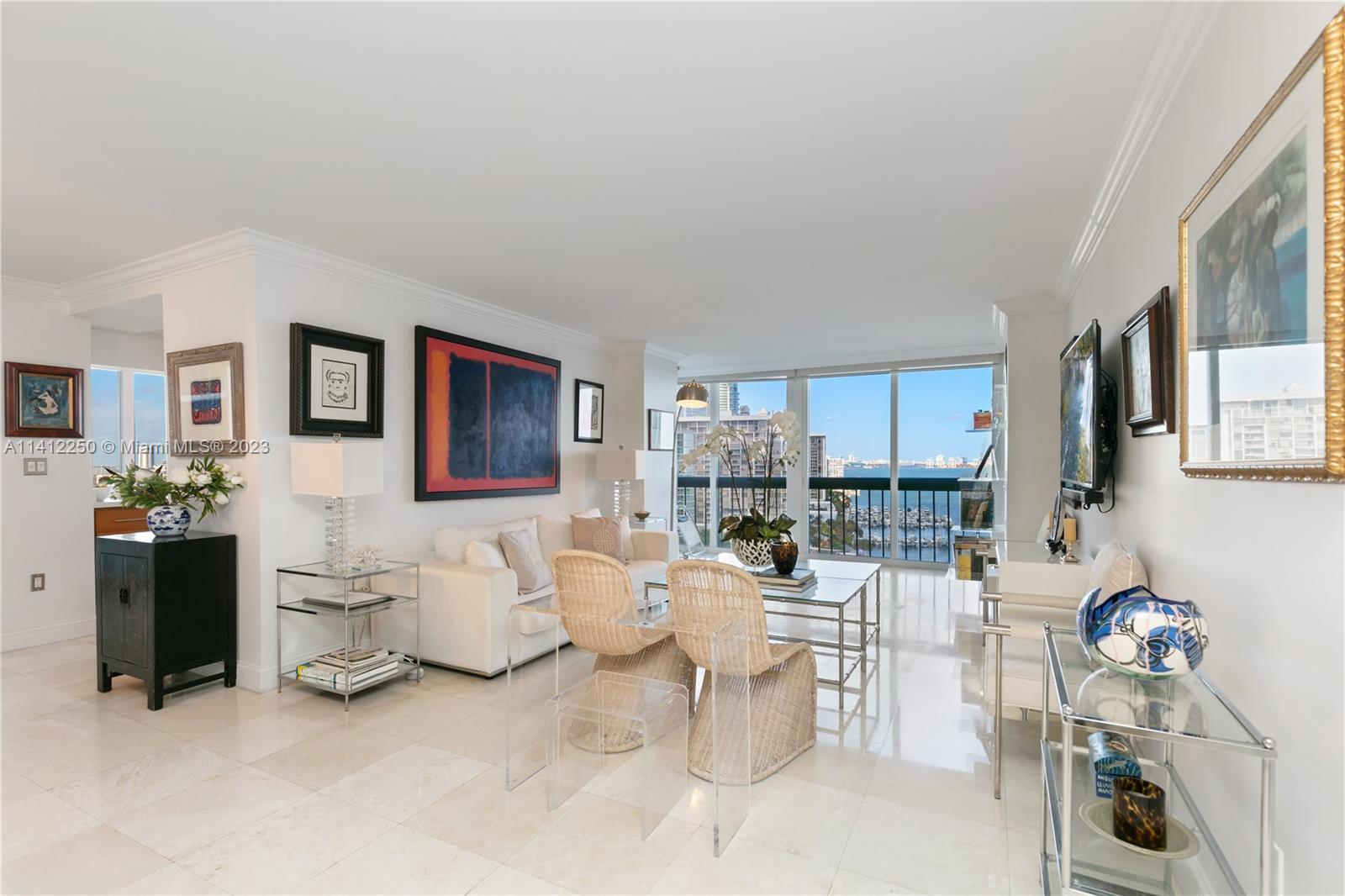 2333 Brickell Avenue, Unit 1511 Miami, FL 33129 - Photo 4 of 59 a living room with furniture and a table