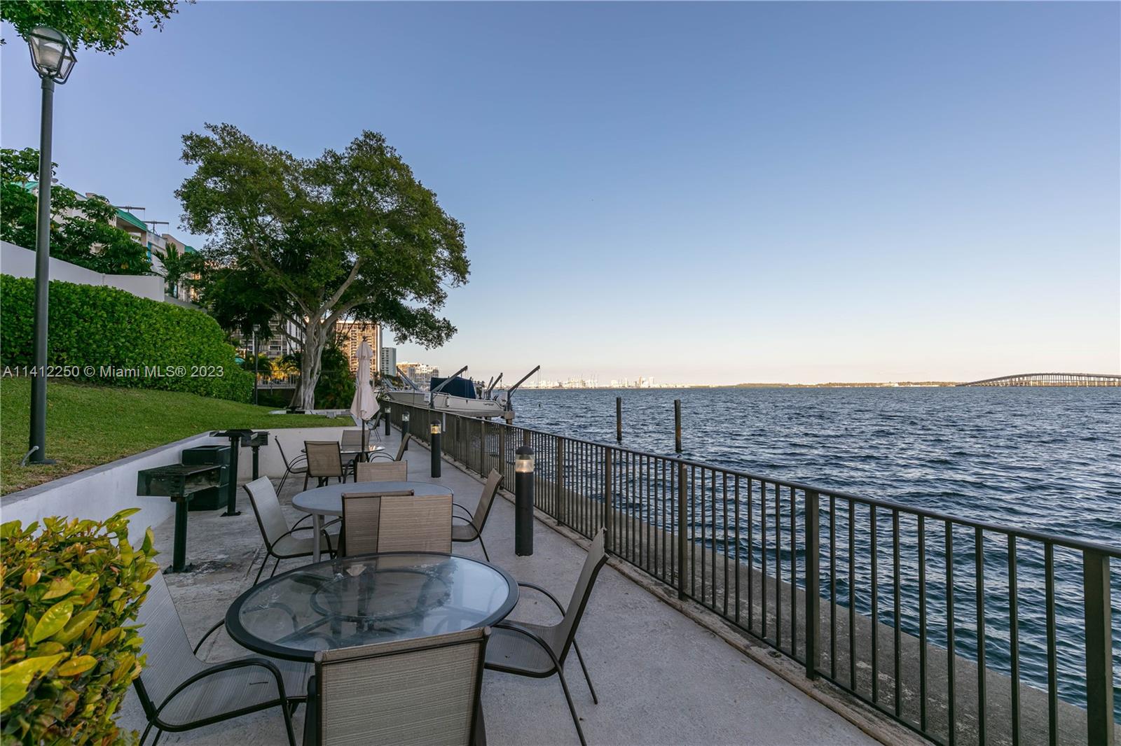 2333 Brickell Avenue, Unit 1511 Miami, FL 33129 - Photo 55 of 59 a view of a balcony with chairs and a table