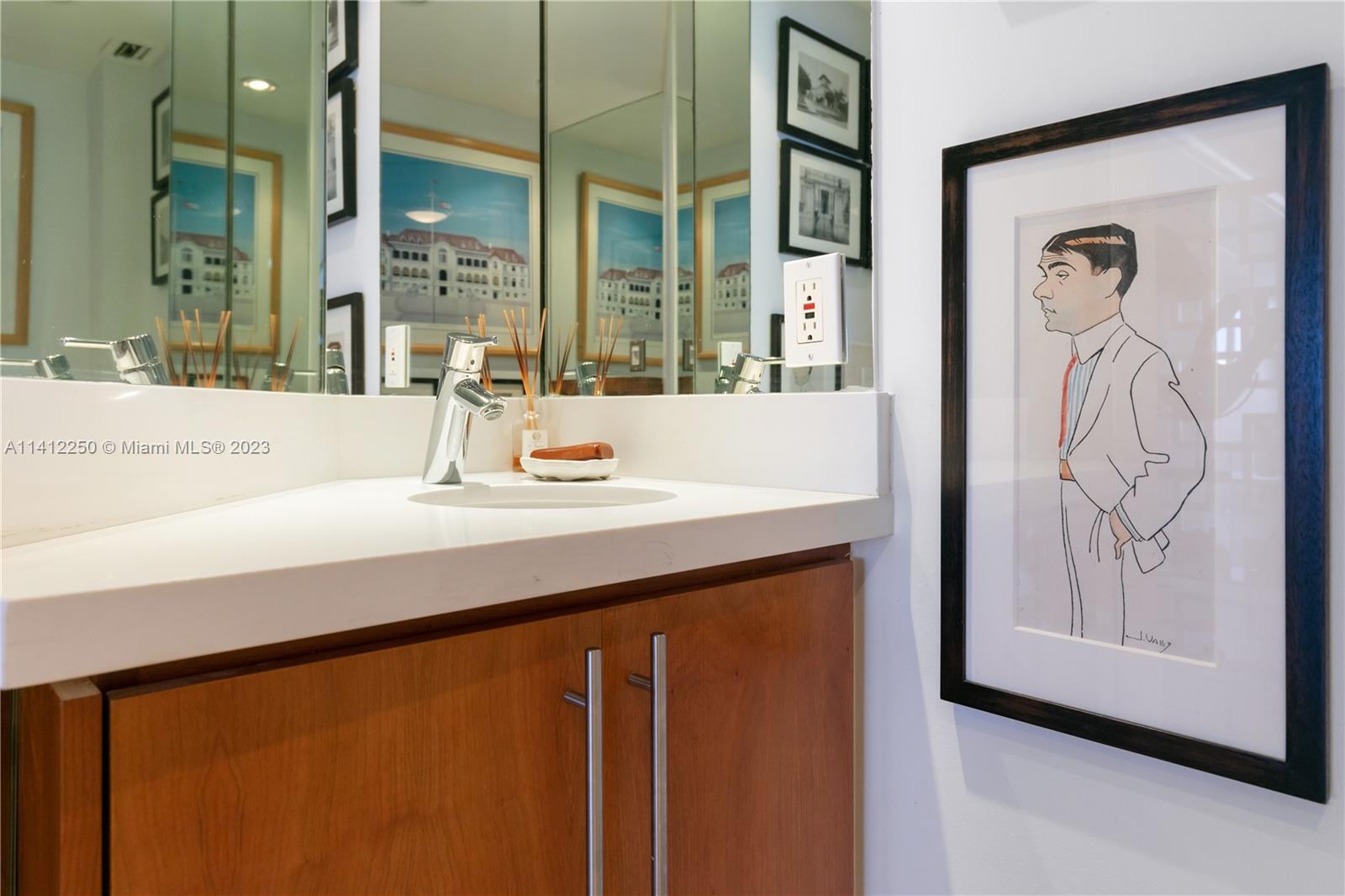 2333 Brickell Avenue, Unit 1511 Miami, FL 33129 - Photo 9 of 59 a bathroom with a sink and a mirror