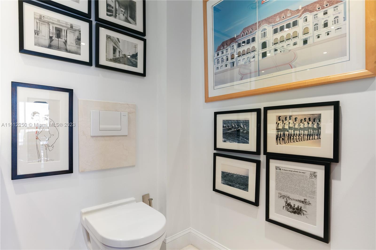 2333 Brickell Avenue, Unit 1511 Miami, FL 33129 - Photo 10 of 59 a bathroom with a toilet and a picture on the wall