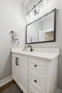 a bedroom with bed and a window