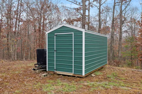 a view of a city with lush green forest