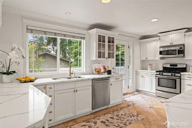 a kitchen with a sink stove and wooden cabinets