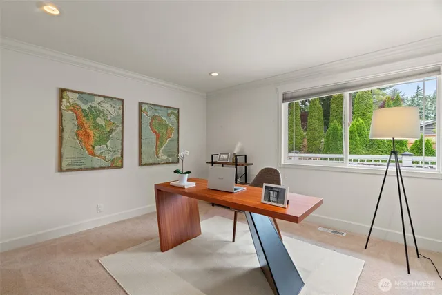 a workspace with furniture and a window