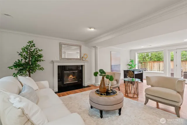 a living room with furniture a window and a fireplace