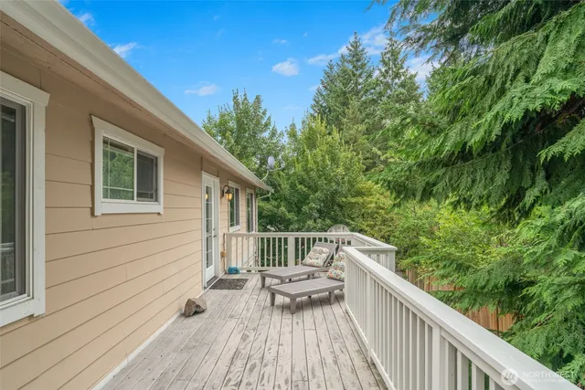 a view of balcony with deck and wooden floor