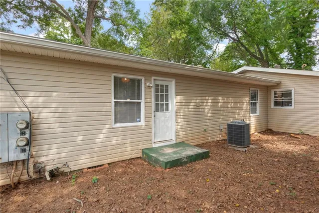 a view of a backyard with a large tree